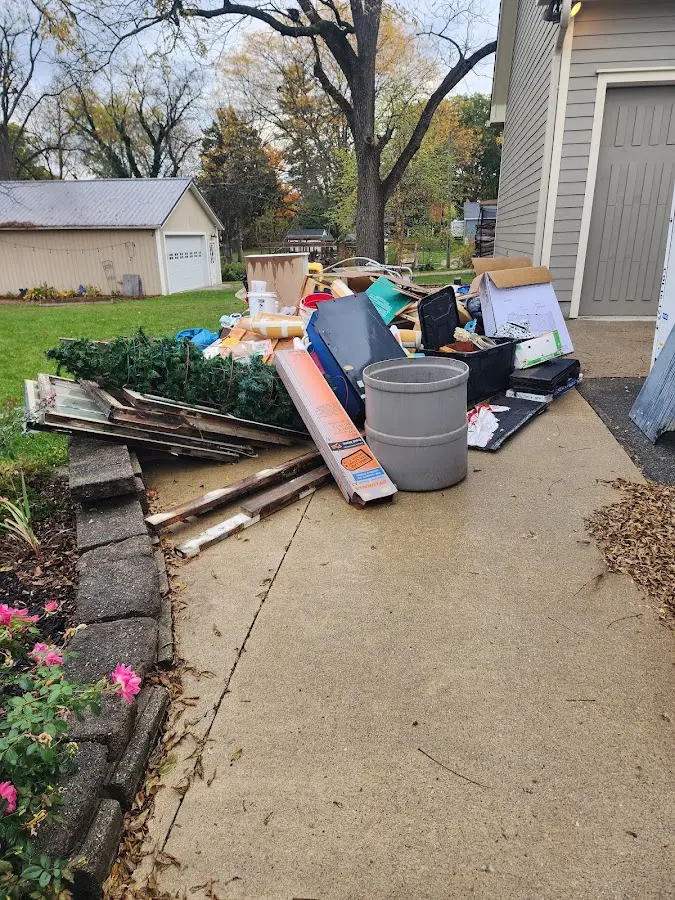 Dumpster being loaded with debris for Estate Cleanout Dumpster Rental in Youngstown